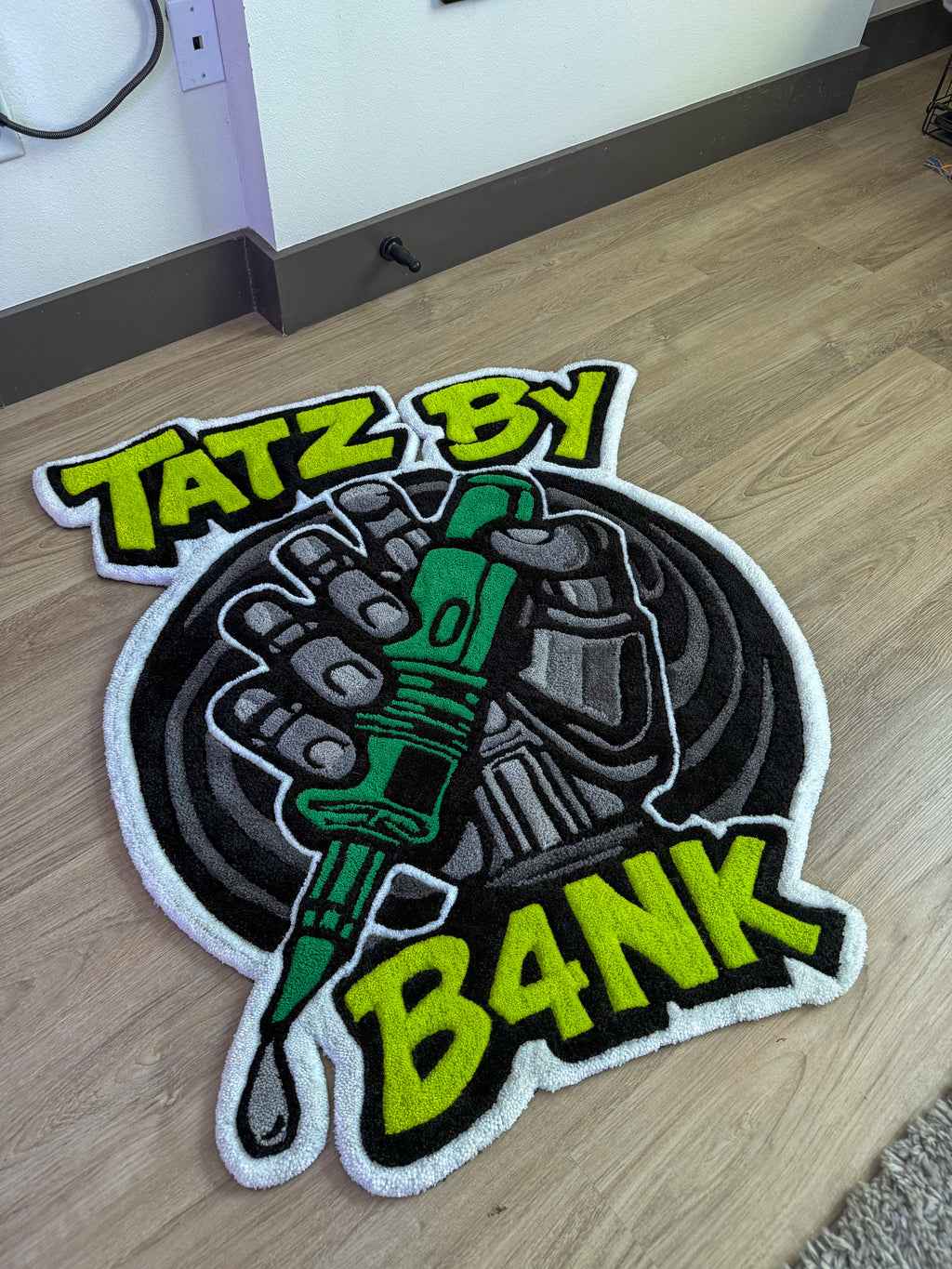 “TATZ BY B4NK”